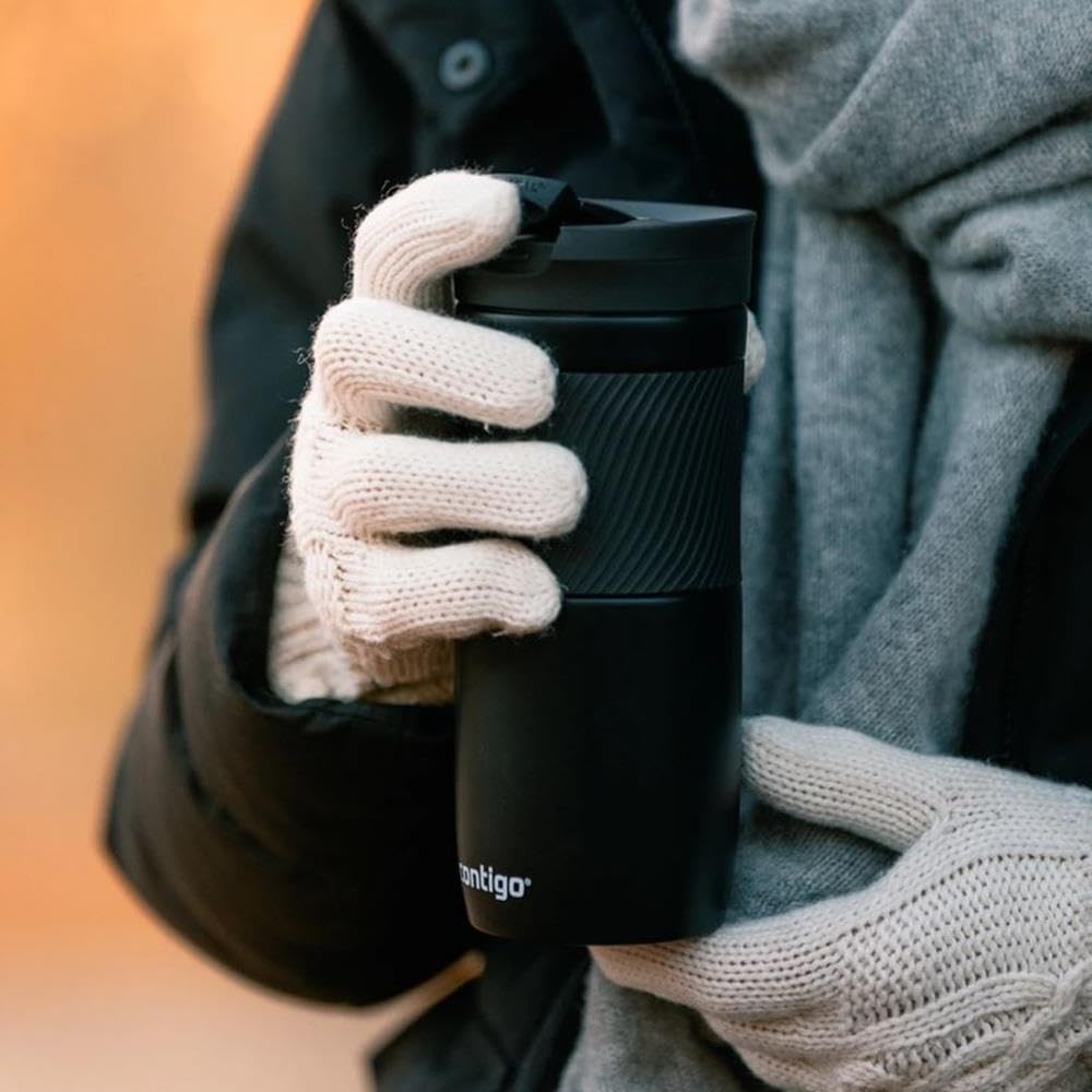 Person holding a black Contigo water bottle with gloves on a blurred background