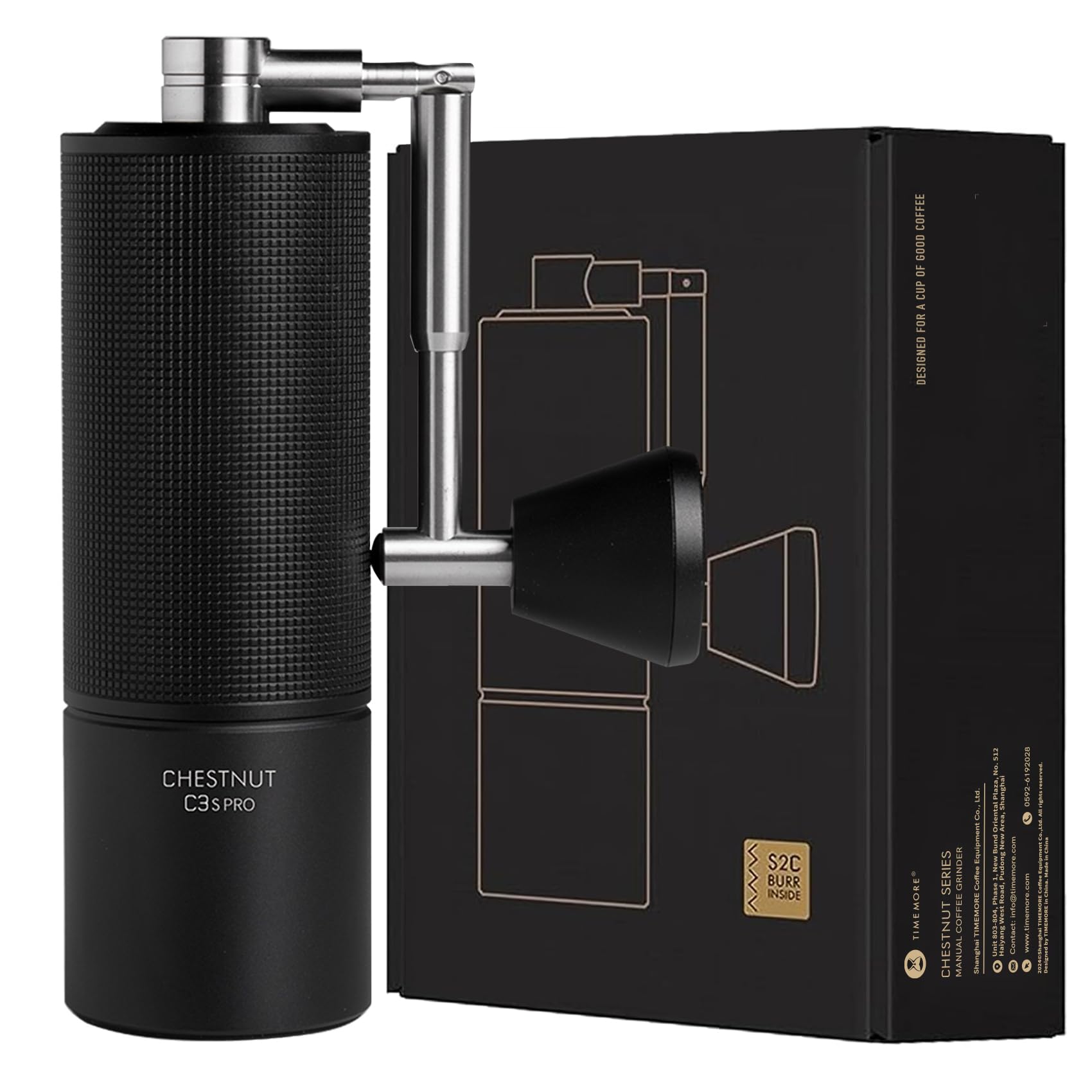 Black coffee grinder with metallic accents next to its packaging on a white background