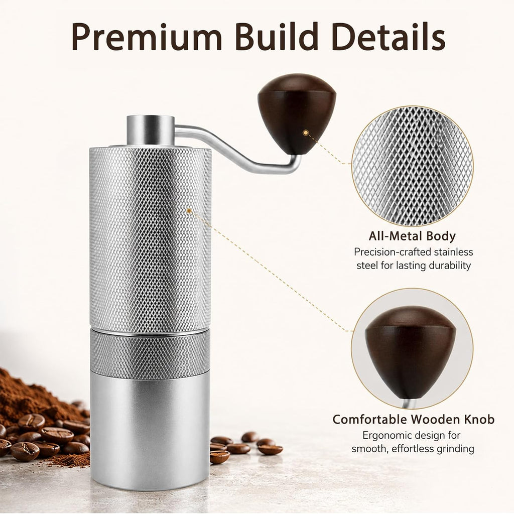 A manual coffee grinder with a brushed silver metal body and a dark brown wooden knob, shown on a light beige background with coffee beans and text callouts highlighting its all-metal body and comfortable wooden knob.