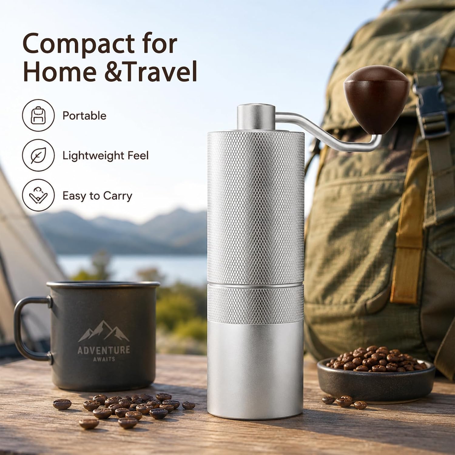 A compact manual coffee grinder with a textured silver body and a dark brown wooden handle, shown on a wooden table with coffee beans, a black camping mug, and a backpack in the background. Text on the left highlights its portability, lightweight feel, and ease of carry.