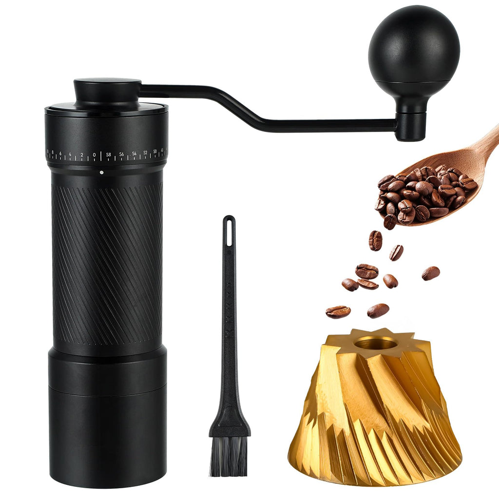 Manual coffee grinder set with a black hand-crank grinder, small cleaning brush, gold-toned conical coffee filter, and a wooden spoon of coffee beans on a white background.